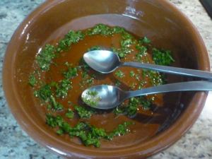 In the serving dish, mix the Olive Oil, Chili and Cilantro