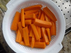 Peel and cut the carrots in 3 inches sticks, wash them